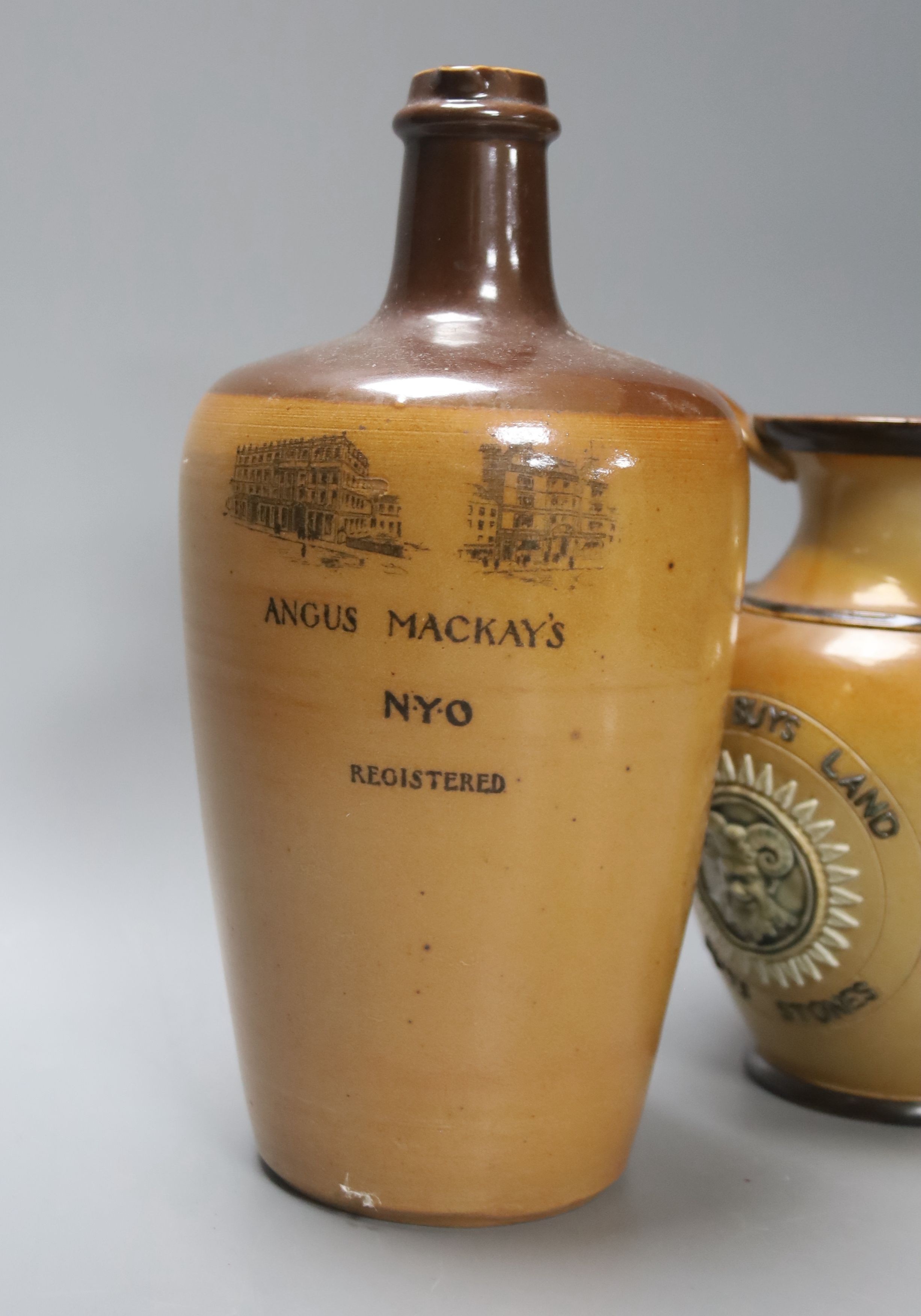 A Doulton Lambeth Angus Mackay's N.Y.O. stoneware flagon, 26cm, and a similar motto jug, 19cm